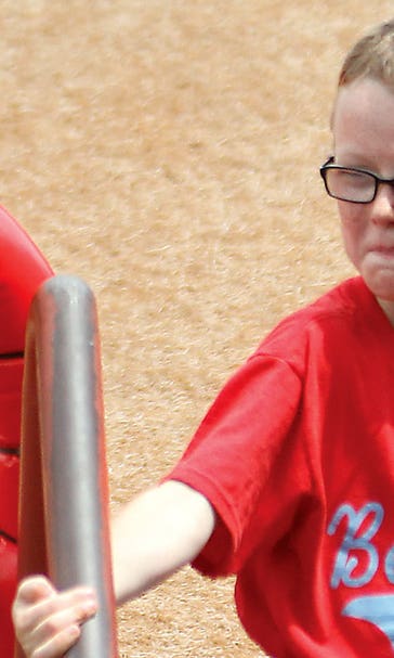 League suspends use of bat boys, girls after 9-year-old's death